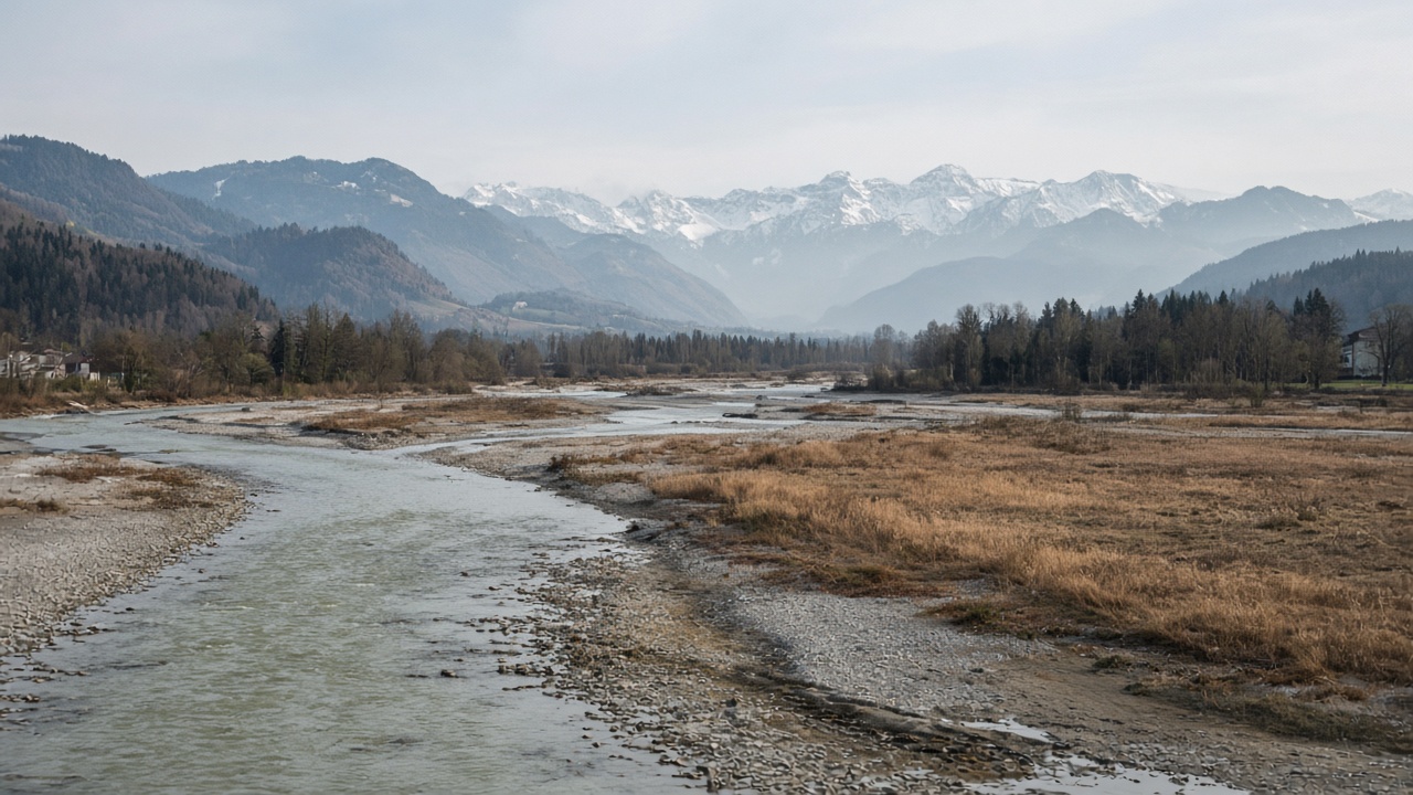 A low Swiss river with exposed gravel after a dry spring